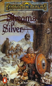 The cover of Streams of Silver. Many skulls are suspended by ropes from the branches of a tree. At the base of the tree is Bruenor, an angry dwarf wearing a horned helmet with one horn broken off. He's carrying a shield with an arrow stuck through it and wielding an axe. On the snowy landscape behind him stand Drizzt, a cloaked dark elf wielding two scimitars; Regis, a plump halfling wielding a dagger, and Wulfgar, a muscular barbarian holding a hammer.