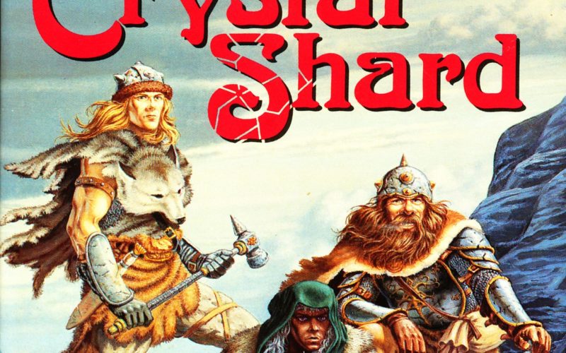 The cover of The Crystal Shard. Three figures pose dramatically on the tundra. One is a young barbarian man wearing furs and wielding a hammer. Another is a dark elf, crouching to inspect a line of blood in the snow. The third is a long-bearded, armoured dwarf with an axe. All of them are looking off into the distance at something behind the viewer.