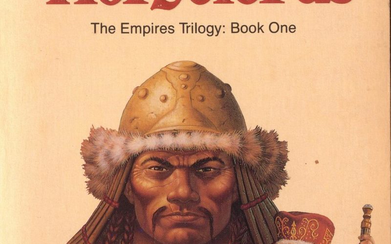 The cover of Horselords. In the background is a portrait of Yamun Kahan, a Mongol-looking man with strong cheekbones and a thin moustache. He's wearing a furred helmet and staring at the camera intensely. In the foreground is Koja, a tonsured priest on a horse, talking to a mounted cavalryman. On the right is Eke Bayalun, a woman holding a staff and dressed in furs staring off into the distance.