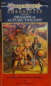 The cover of Dragons of Autumn Twilight. A cloaked, bearded half-elf, a blond woman carrying a staff, and an armored knight with an awesome moustache stand in front of a hill. A red dragon curls around the hill behind them. Everything is in shades of red and gold.