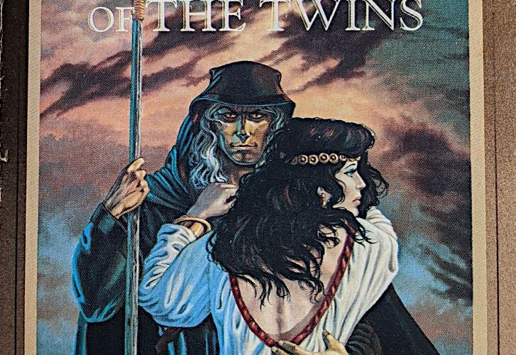 The cover of Time of the Twins. A black-robed, bronze-skinned mage stares directly at the viewer. In one hand he holds a magic staff; the other arm is around the waist of a black-haired young woman in white robes. She seems distracted, staring off to the side with a concerned expression. Behind them is a sky full of roiling clouds.